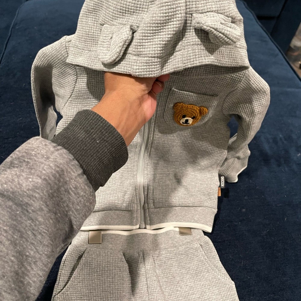 Dress up your little one in this adorable unisex Moschino Bear Sweatsuit.